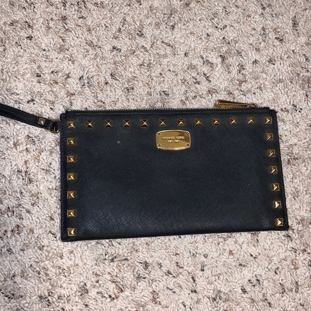 black michael kors wristlet with gold details